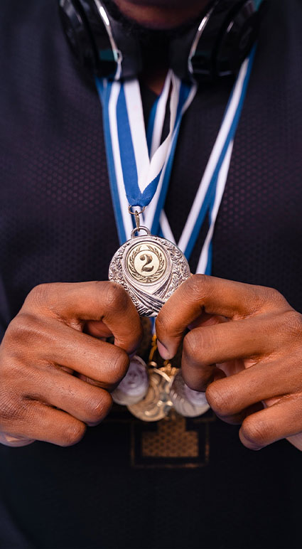 hand holding 2nd place medal